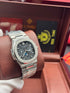 Patek- PHILIPPE STEEL NAUTILUS WITH MOON PHASE AND POWER RESERVE