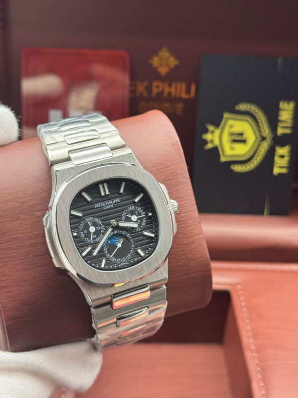 Patek- PHILIPPE STEEL NAUTILUS WITH MOON PHASE AND POWER RESERVE