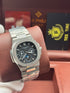 Patek- PHILIPPE STEEL NAUTILUS WITH MOON PHASE AND POWER RESERVE