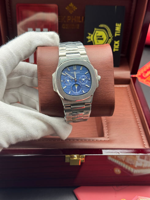 Patek- PHILIPPE STEEL NAUTILUS WITH MOON PHASE )
