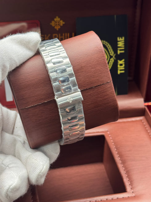 Patek- PHILIPPE STEEL NAUTILUS WITH MOON PHASE )